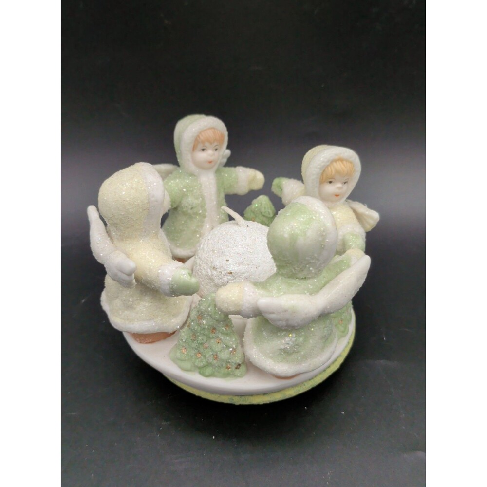 vintage porcelain circle candle holder featuring children or angels in green and